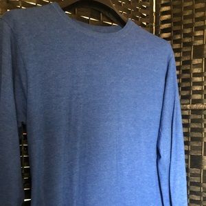 Long sleeve blue T-shirt.